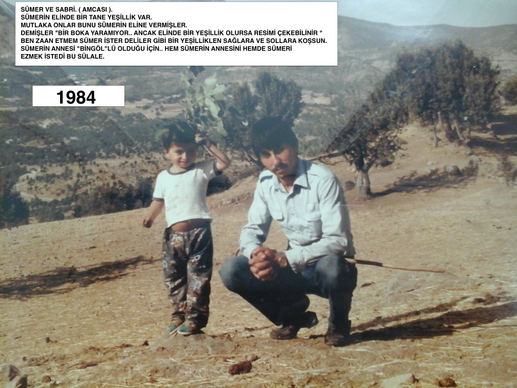 Sumer poses with his father in the desert